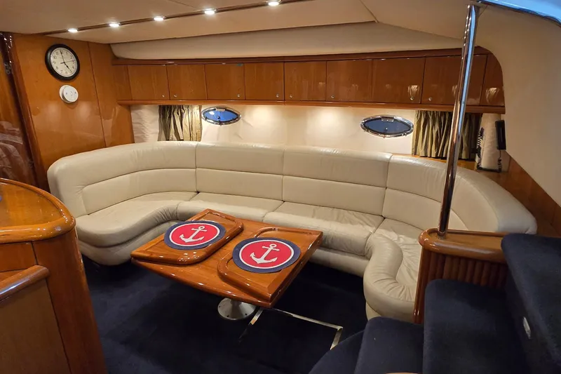 Slide: The Image of Luxurious interior of 2004 Sunseeker Camargue 50 yacht with elegant seating and nautical decor. - 30