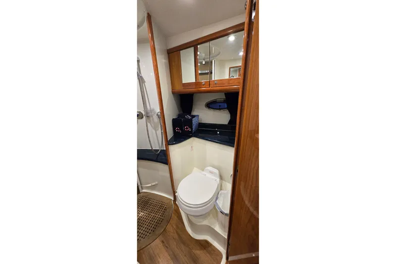 Slide: The Image of Luxurious bathroom in 2004 Sunseeker Camargue 50 yacht with wood accents and modern fixtures. - 37