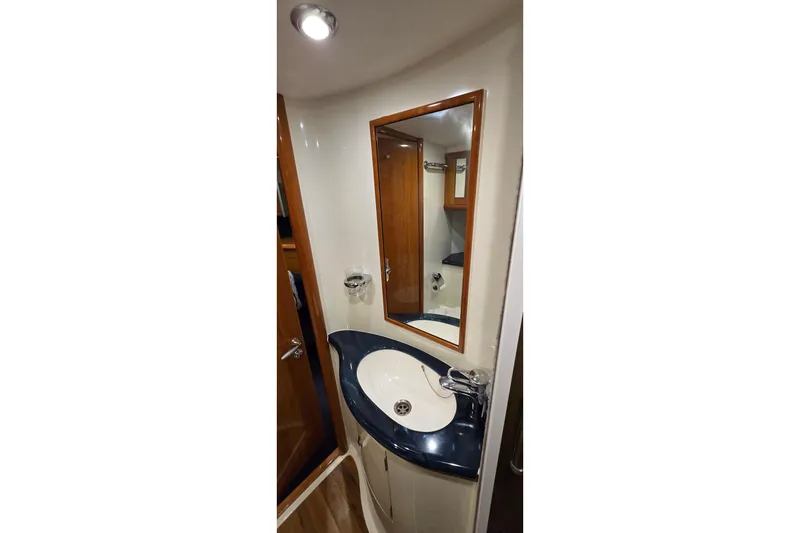 Slide: The Image of Bathroom interior of 2004 Sunseeker Camargue 50 yacht with modern sink and mirror. - 38
