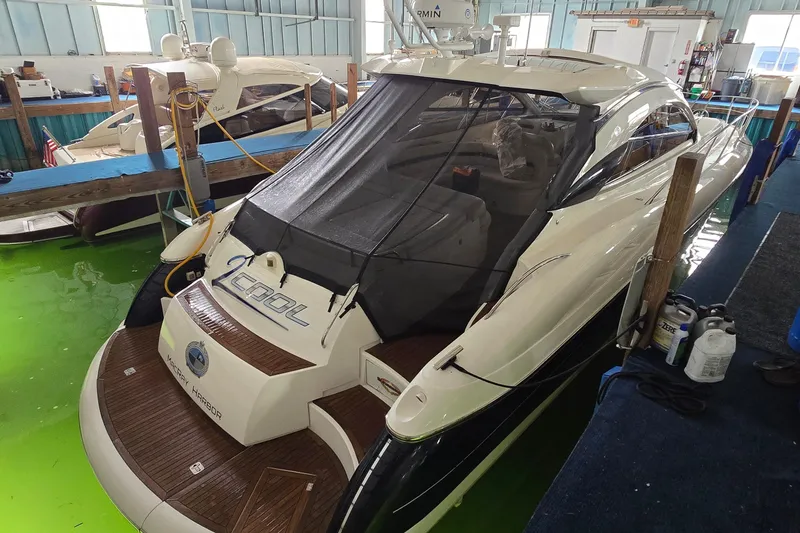 Slide: The Image of 2004 Sunseeker Camargue 50 yacht docked indoors with protective cover. - 4