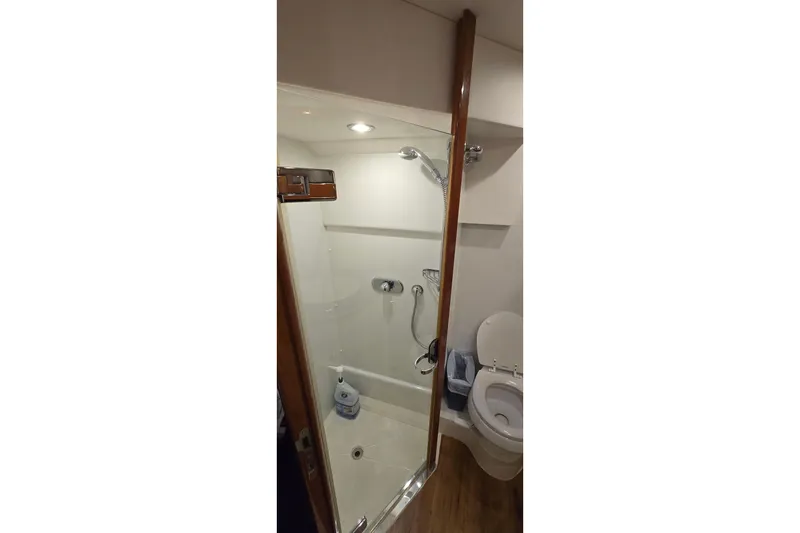 Slide: The Image of Bathroom interior of 2004 Sunseeker Camargue 50 yacht, featuring shower and toilet. - 43