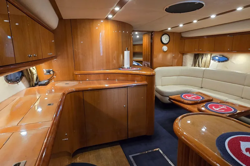 Slide: The Image of Luxurious interior of 2004 Sunseeker Camargue 50 yacht with elegant wood finish and seating area. - 46