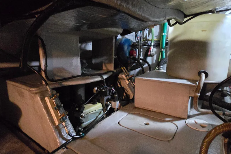 Slide: The Image of Engine room of a 2004 Sunseeker Camargue 50 yacht, showcasing mechanical components. - 49