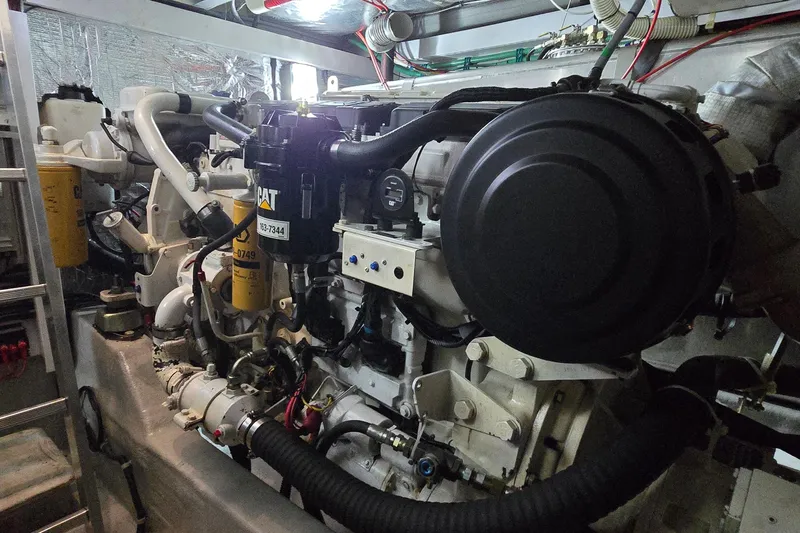 Slide: The Image of Engine room of 2004 Sunseeker Camargue 50 yacht, featuring CAT machinery. - 52
