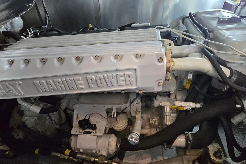 Slide: The Image of Engine compartment of a 2004 Sunseeker Camargue 50 yacht, featuring a CAT Marine Power engine. - 53