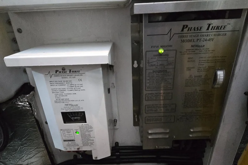 Slide: The Image of Phase Three smart chargers in a 2004 Sunseeker Camargue 50 yacht engine room. - 55