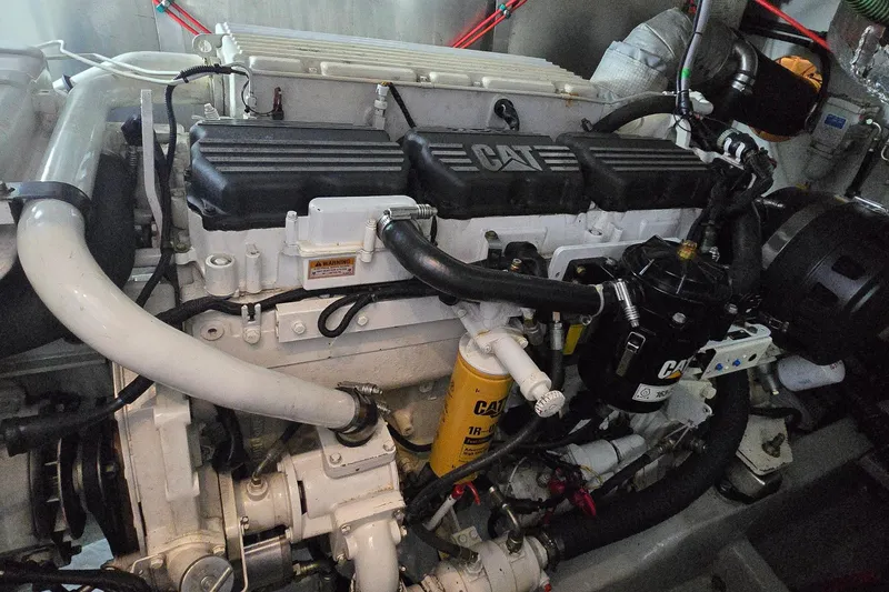 Slide: The Image of Engine of a 2004 Sunseeker Camargue 50 yacht, featuring CAT components. - 56