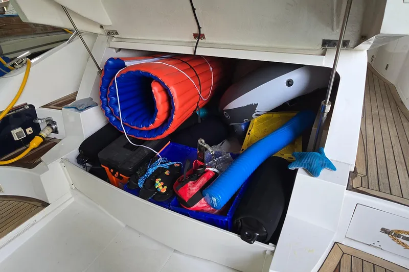 Slide: The Image of Storage compartment of a 2004 Sunseeker Camargue 50 yacht filled with boating accessories. - 8