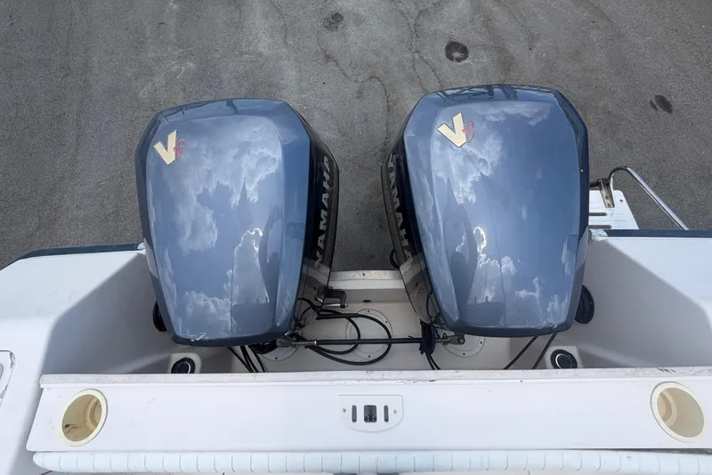 Slide: The Image of Twin Yamaha V6 outboard engines on a 2000 Grady-White Express 265 boat. - 111