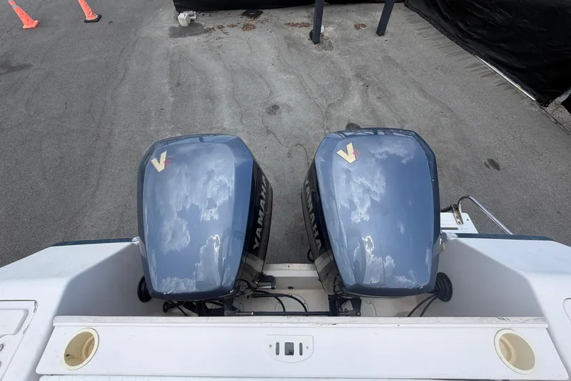 Slide: The Image of Twin Yamaha outboard engines on a 2000 Grady-White Express 265 boat. - 113