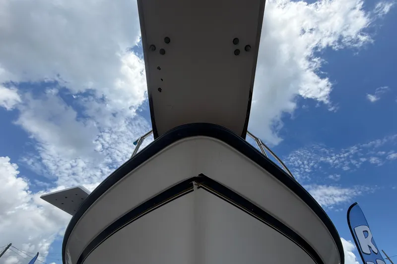 Slide: The Image of Grady-White Express 265 boat from 2000, viewed from below against a cloudy sky. - 12