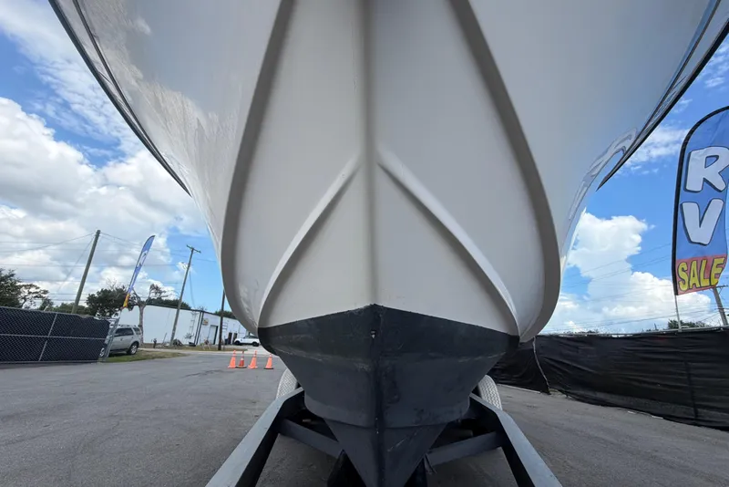 Slide: The Image of Grady-White Express 265 boat on trailer, front view, blue sky. - 14
