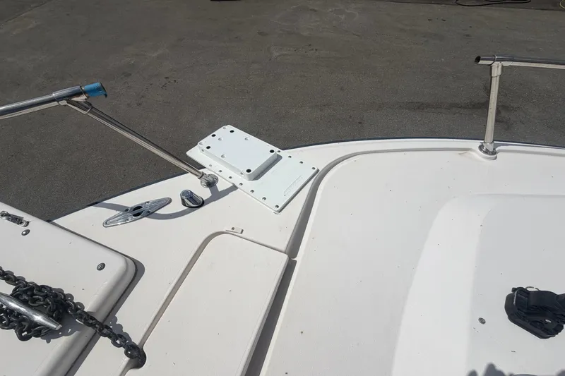 Slide: The Image of Bow deck of 2000 Grady-White Express 265 boat with anchor chain and railing. - 21