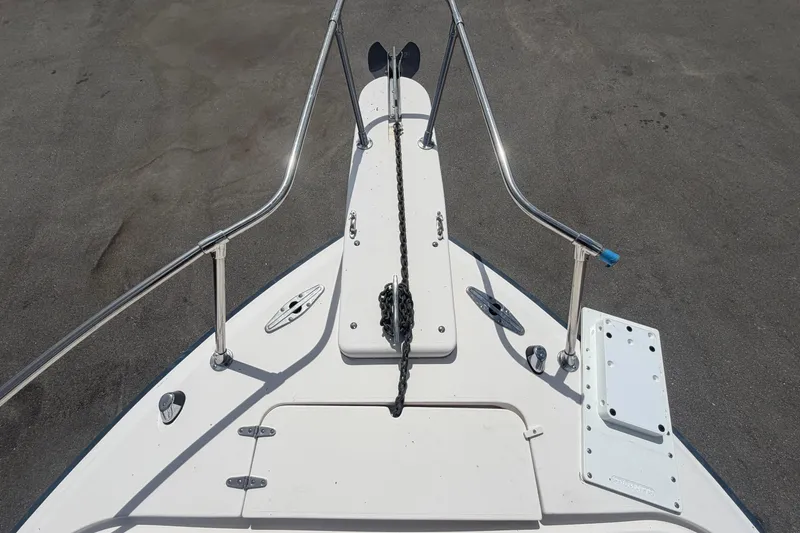 Slide: The Image of Bow view of 2000 Grady-White Express 265 boat with anchor and railings. - 22