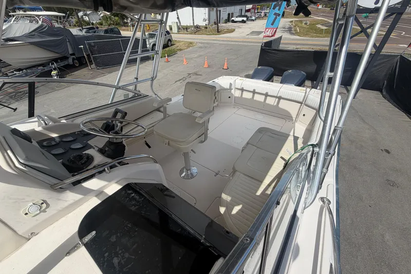 Slide: The Image of 2000 Grady-White Express 265 boat interior with helm and seating area. - 28