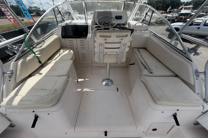 Slide: The Image of 2000 Grady-White Express 265 boat interior with seating and steering console. - 29