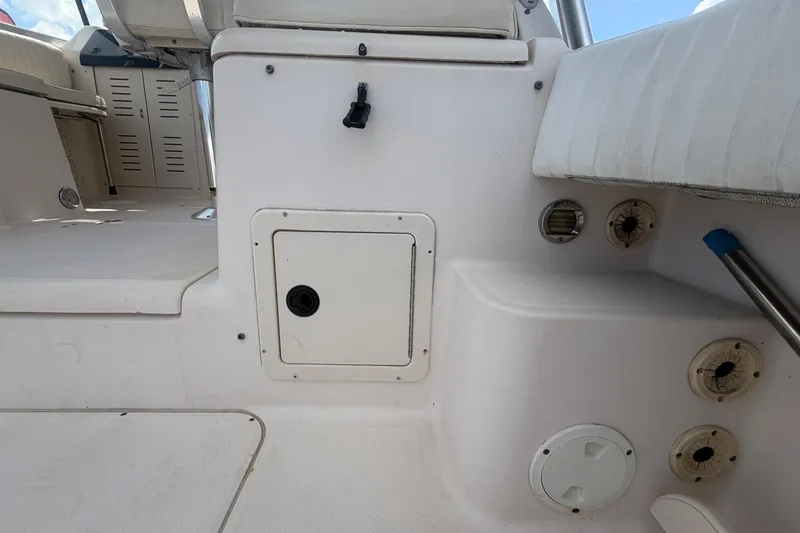 Slide: The Image of Interior view of a 2000 Grady-White Express 265 boat, featuring seating and storage compartments. - 30