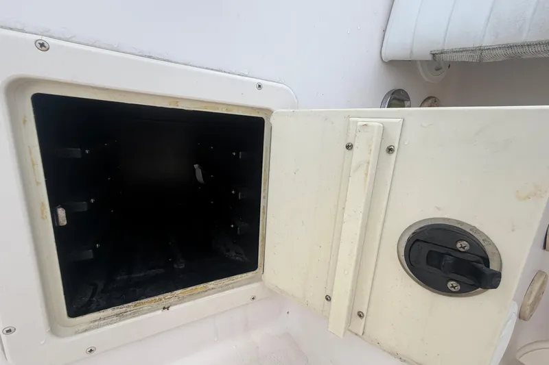 Slide: The Image of Open storage compartment on a 2000 Grady-White Express 265 boat. - 31
