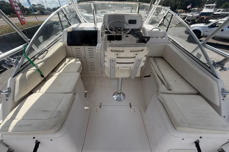 Slide: The Image of 2000 Grady-White Express 265 boat interior with seating and steering console. - 32