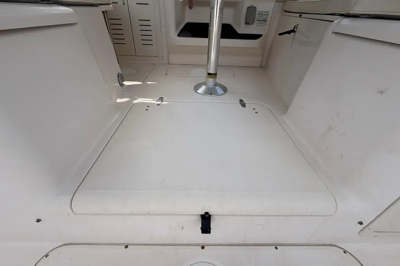 Slide: The Image of Interior view of a 2000 Grady-White Express 265 boat, showcasing storage compartment. - 33