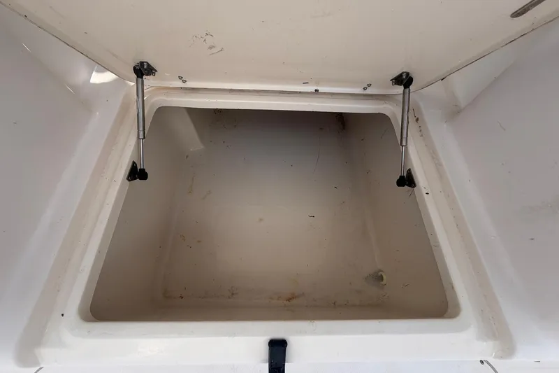 Slide: The Image of Open storage compartment in 2000 Grady-White Express 265 boat. - 34