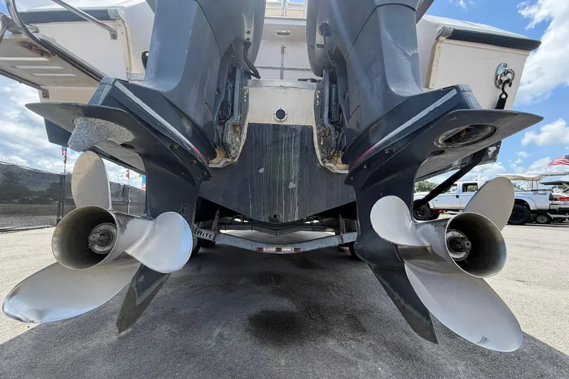 Slide: The Image of Rear view of 2000 Grady-White Express 265 boat with dual outboard motors. - 4