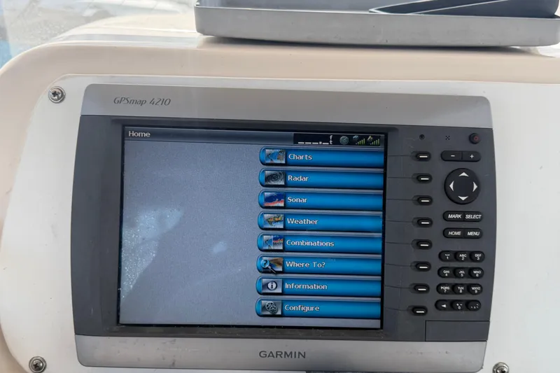 Slide: The Image of Garmin GPSmap 4210 navigation system on a 2000 Grady-White Express 265 boat. - 44