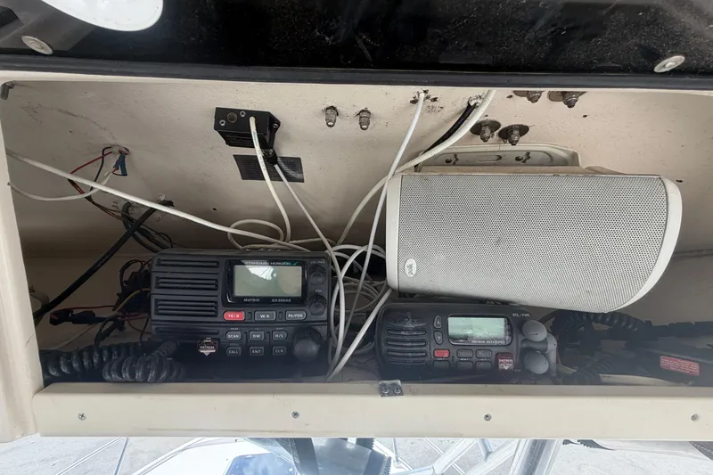 Slide: The Image of Marine electronics and speaker setup on a 2000 Grady-White Express 265 boat. - 55