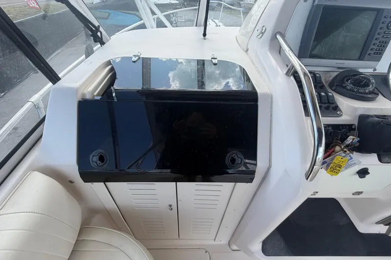 Slide: The Image of Grady-White Express 265 boat dashboard with navigation equipment, 2000 model. - 57
