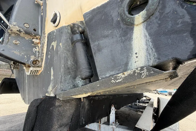 Slide: The Image of Close-up of a 2000 Grady-White Express 265 boat hull on a trailer. - 6