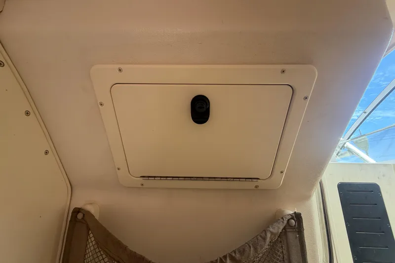 Slide: The Image of Ceiling hatch inside a 2000 Grady-White Express 265 boat cabin. - 84