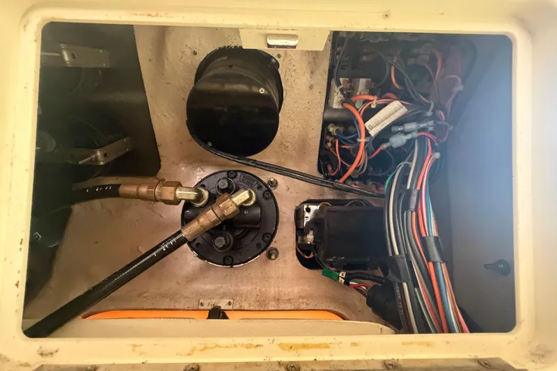 Slide: The Image of Engine compartment of a 2000 Grady-White Express 265 boat, showing wiring and components. - 85