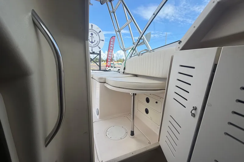 Slide: The Image of Interior view of a 2000 Grady-White Express 265 boat, showcasing seating and storage. - 88