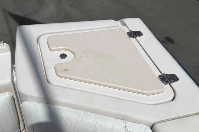 Slide: The Image of Hinged compartment on 2000 Grady-White Express 265 boat deck. - 98