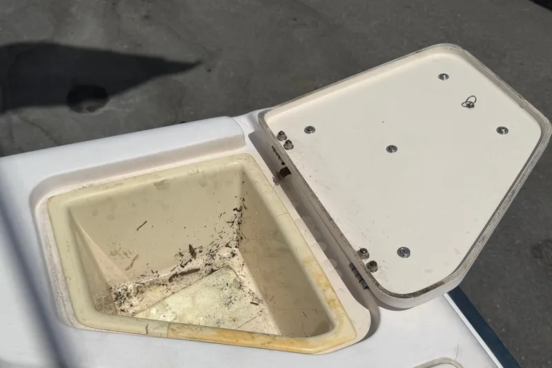Slide: The Image of Open storage compartment on a 2000 Grady-White Express 265 boat. - 99