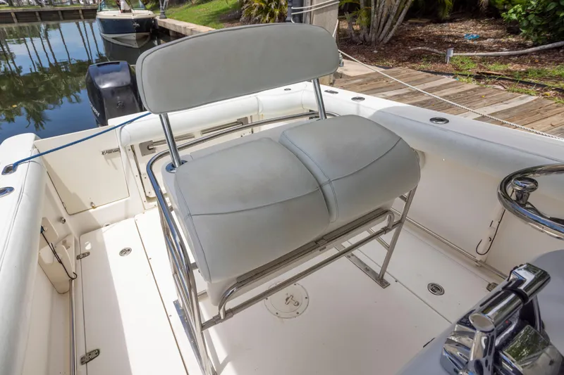 Slide: The Image of 2007 Boston Whaler 270 Outrage boat interior with cushioned seating and stainless steel frame. - 10