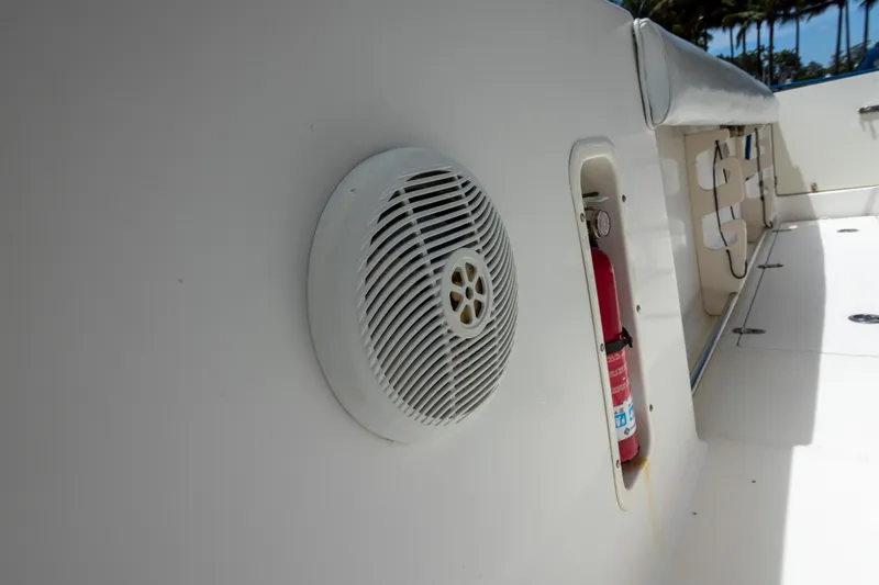 Slide: The Image of 2007 Boston Whaler 270 Outrage interior with speaker and fire extinguisher. - 11