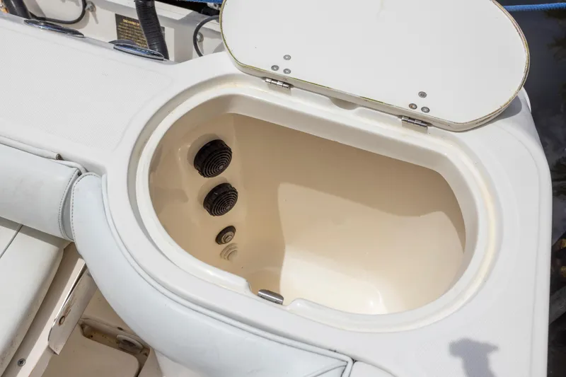 Slide: The Image of Open storage compartment on a 2007 Boston Whaler 270 Outrage boat. - 4