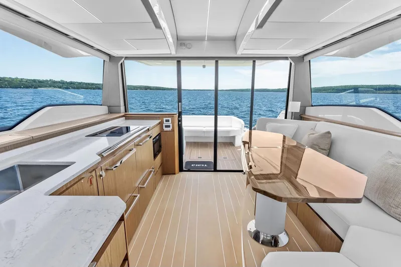 Slide: The Image of Luxurious interior of 2025 Tiara Yachts EX 60 with modern kitchen and seating area. - 75
