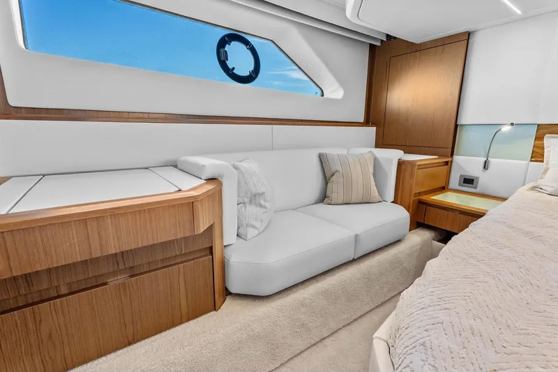 Slide: The Image of Luxurious interior of 2025 Tiara Yachts EX 60 with elegant wood and white furnishings. - 45