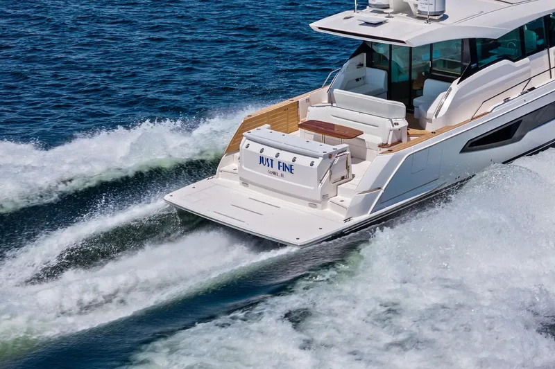 Slide: The Image of 2025 Tiara Yachts EX 60 cruising on open water, showcasing sleek design and luxury features. - 72