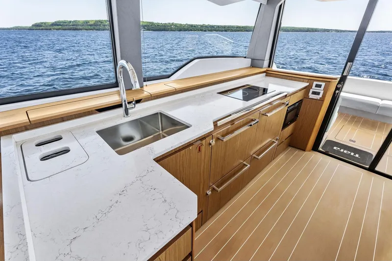 Slide: The Image of Luxurious 2025 Tiara Yachts EX 60 kitchen with sleek countertops and modern appliances. - 62