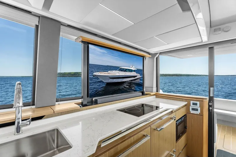 Slide: The Image of Modern kitchen interior of 2025 Tiara Yachts EX 60 with ocean view. - 68