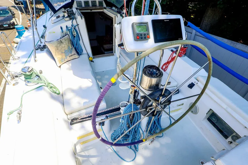 Slide: The Image of Cockpit of 2001 J Boats J/32 sailboat with steering wheel and navigation equipment. - 6