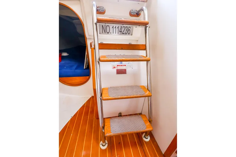 Slide: The Image of Interior of 2001 J Boats J/32 sailboat showing wooden steps and cabin entrance. - 30