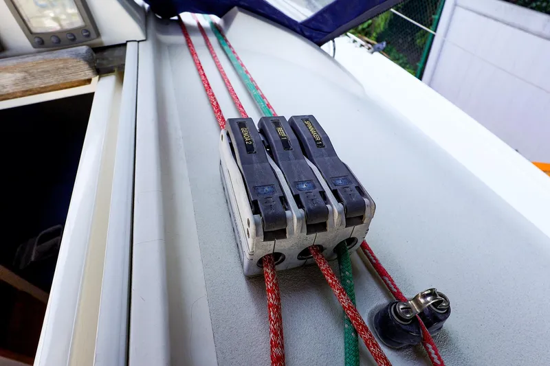 Slide: The Image of Close-up of a 2001 J Boats J/32 sailboat deck with rope clutches and lines. - 17