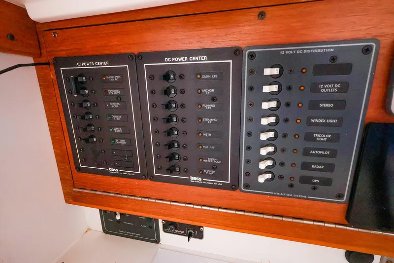 Slide: The Image of Electrical panel on a 2001 J Boats J/32, featuring AC and DC power controls. - 37