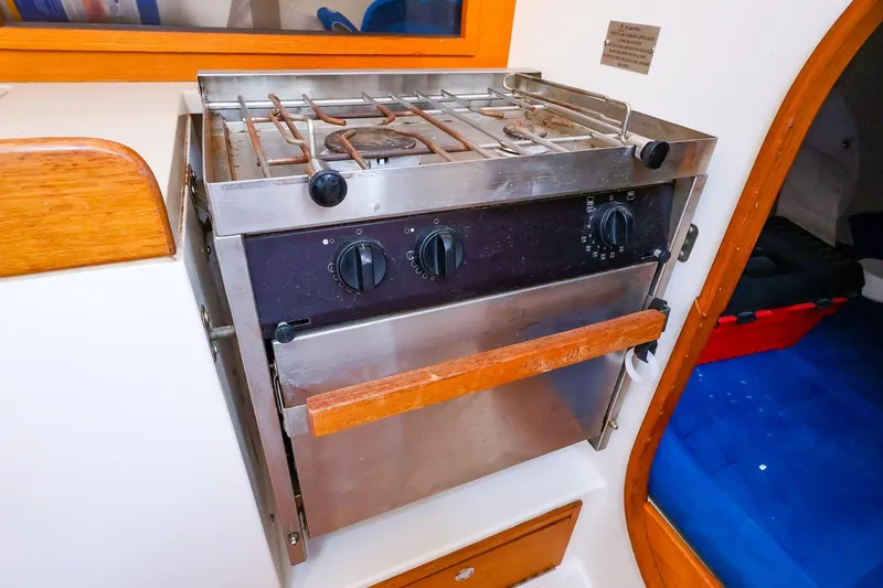 Slide: The Image of Stainless steel stove and oven in 2001 J Boats J/32 yacht galley. - 32