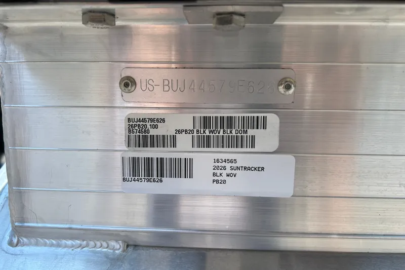 Slide: The Image of 2026 Sun Tracker Party Barge 20 DLX identification plate with serial numbers and barcodes. - 98