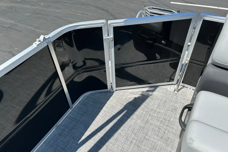 Slide: The Image of 2026 Sun Tracker Party Barge 20 DLX interior with sleek railing and comfortable seating. - 14
